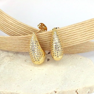 Elegant gold teardrop earrings with pavé cubic zirconia on textured stone base