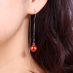 Elegant S925 silver long tassel earrings with red agate beads shown on a model