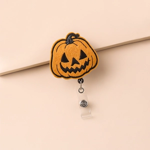Halloween pumpkin embroidered badge reel with retractable clip and orange felt finish