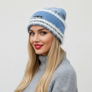 Close-up of the fuzzy mohair texture and stripe detail on this warm blue knitted beanie
