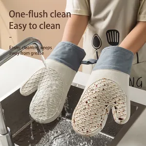 Waterproof silicone oven mitt with non-slip texture showing easy cleaning under water