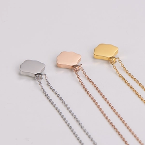 Three cloud-shaped necklaces in silver, rose gold and gold finish on white background
