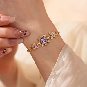 Vintage gold-plated bracelet with oval purple gemstone and star-shaped zircon accents