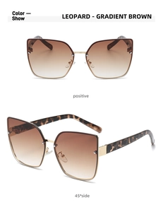 Detail view of leopard print cat eye sunglasses with gradient brown lenses at 45-degree angle