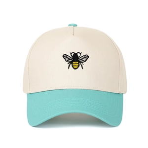 Two-tone beige and mint green five-panel cap with bee embroidery on the front