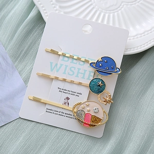Three-piece starry sky themed hair clips with blue enamel and sparkling rhinestones