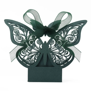 Detail of dark green hollow laser-cut butterfly gift box with matching silk ribbon bow