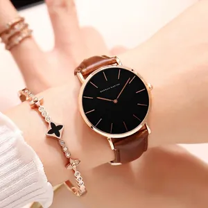 Minimalist quartz watch for women featuring a rose gold case and brown leather strap