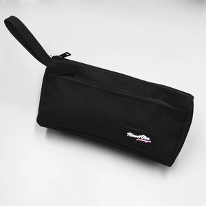 Close-up of durable black canvas pencil case showing the zipper and wrist strap detail
