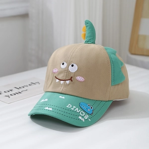 Detail of cartoon dinosaur embroidery and three-dimensional fins on kids baseball cap