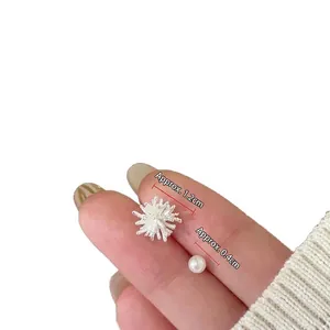 Sparkling starburst studs and pearl earrings set in silver-plated minimalist design
