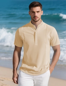Close-up of beige men's knit polo with intricate hollow-out stripe texture and buttons