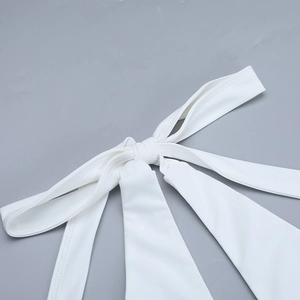Close-up detail of white halter neck tie straps and delicate gathered fabric texture