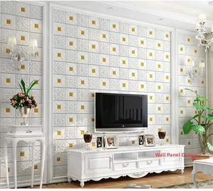 Detail of 3D embossed self-adhesive wall tile with white pattern and golden center