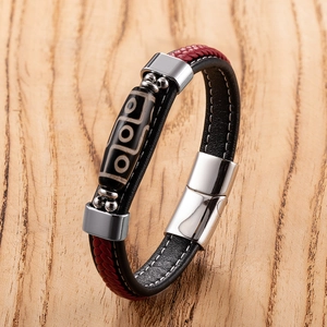 Ethnic braided leather bracelet with nine-eyed dzi bead and magnetic steel clasp