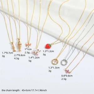 Minimalist animal and fruit pendant necklaces on silk, available in gold and silver finish