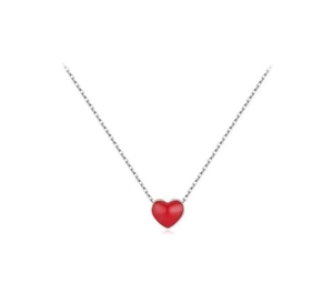 Detailed view of the sterling silver chain with a polished red heart enamel pendant
