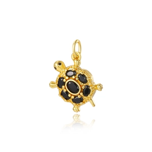 Elegant 18k gold plated sea turtle pendant with black oval gemstones on white background
