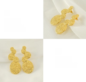 Detail of 18K gold plated titanium steel earrings with molten texture and polished finish