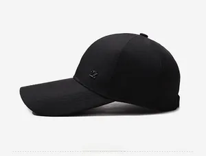 Side view of black long brim baseball cap with silver metal Z logo detail