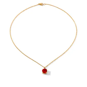 Detail of gold chain necklace featuring a red round zircon pendant with measurement labels