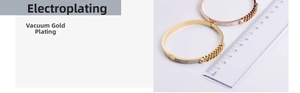 Detail view of gold and rose gold titanium steel bangles with pave-set cubic zirconia accents