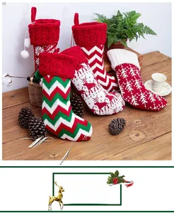 Set of four knitted Christmas stockings with elk and snowflake patterns for holiday decor