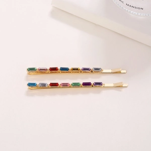 Golden hair clips with colorful rectangular crystal rhinestones for a stylish look