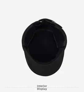 Detail view of the warm fleece interior lining and adjustable metal buckle on a wool cap