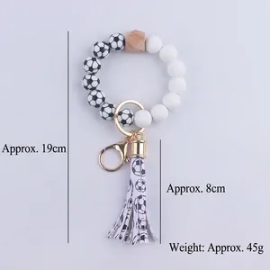 Portachiavi bracciale calcio in silicone con nappa in pelle PU e anello dorato