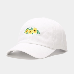 White cotton baseball cap with sunflower embroidery and curved brim in classic style