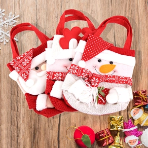 Detailed knit texture and felt patchwork of Christmas Santa and Snowman gift bags