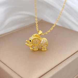 Macro shot of 18k gold plated titanium elephant necklace with pavé zircon stones
