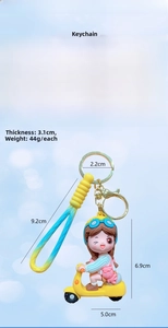 Detail of cartoon girl on yellow scooter keychain with PVC strap and size dimensions