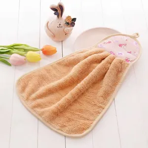 Close-up of soft coral fleece hand towel with cute cartoon print and ruffle edge