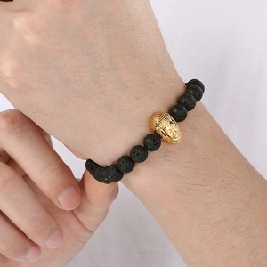 8mm lava stone beaded bracelet with gold Buddha head on a wrist for men