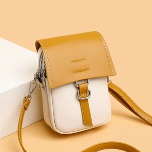Mini bicolor shoulder phone bag in cream and mustard yellow with adjustable strap