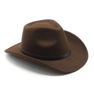Close-up of the vintage brown wool felt hat with a black leather band decoration