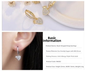 Macro detail of S925 silver heart crown earrings with sparkling AAA cubic zirconia inlay