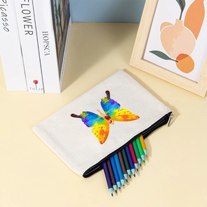 Detail of white canvas pencil case with vibrant hand-painted butterfly print and metal zipper