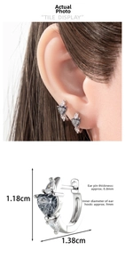 Detailed view of silver heart earrings with size measurements and model display