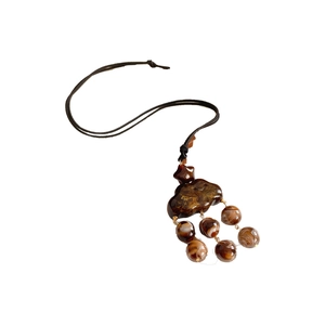 Ethnic style necklace with gold foil cloud pendant and brown marble beads on black cord