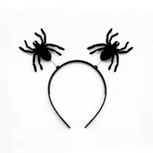 Detail of Halloween headband featuring black flocked spiders and a plastic base on white background