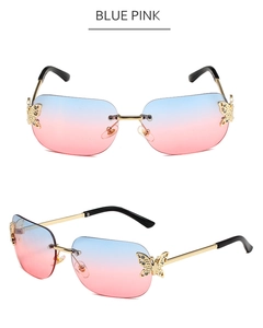 Detail of rimless butterfly sunglasses with blue pink gradient lenses and crystal accents