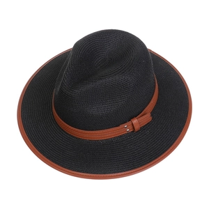 Close-up of black woven straw jazz hat with brown leather belt and metal buckle detail