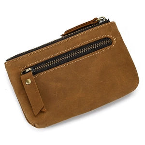 Detailed close-up of brown crazy horse genuine leather wallet with zippers and key ring