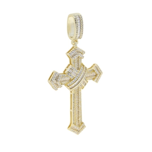 Macro view of gold hip hop cross pendant with clear zircon inlay on white background