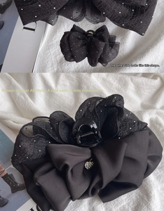 Detail of double-sided hair claw clip with black satin, mesh and silver rhinestones