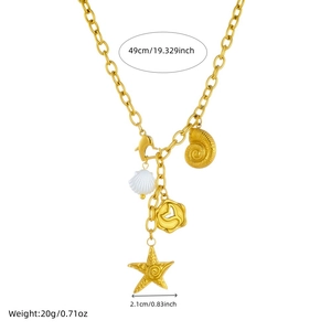 Gold stainless steel ocean necklace with starfish and shell pendants on white background