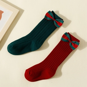 Christmas kids ribbed knit crew socks with festive red and green velvet bows